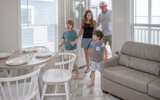 Family entering waterfront cottage